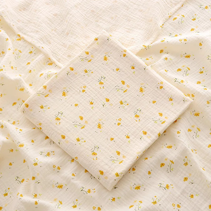 Quilt with yellow floral pattern on beige fabric