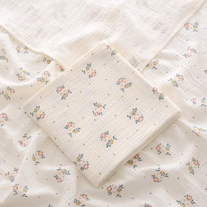 Floral patterned fabric with a quilted texture