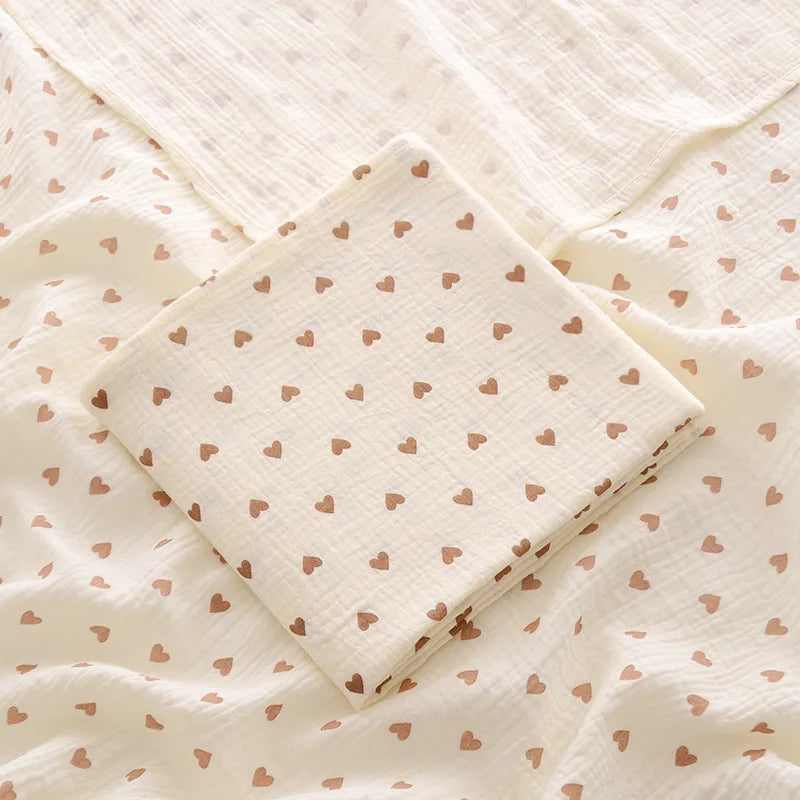 Folded fabric with heart pattern on a textured background