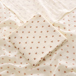 Folded fabric with heart pattern on a textured background