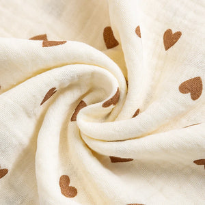 White fabric with brown heart patterns