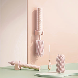 Set of pink hair care tools on a pastel background