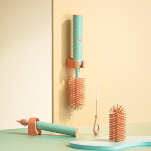 Turquoise hair styling tool with orange accents on a beige background