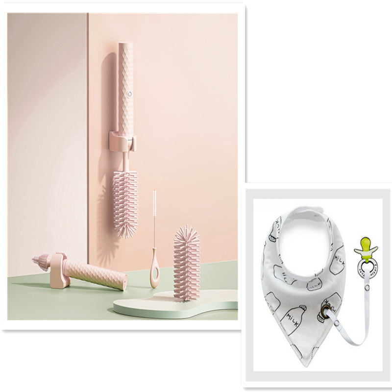 Set of baby care products including a bandana bib with a teether on a white background.