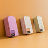 Three rectangular devices in pink, beige, and green on a matching orange background