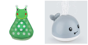 Toy with green body and white polka dots, and gray whale-like body with water sprayer on a white background