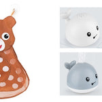Plush toy with deer design and two whale toys on a white background