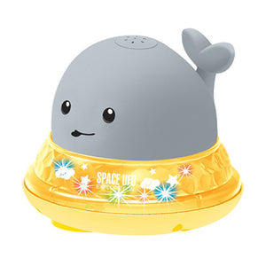 Whale-shaped night light with a yellow base on a white background