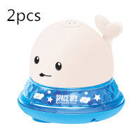 Two cartoon whale-shaped night lights with a white background
