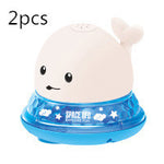Two cartoon whale-shaped night lights with a white background