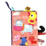 Children's soft book with farm animals on a pink background