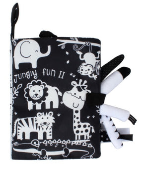 Black and white soft book with animal illustrations and a teether on a white background