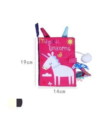 Children's book with unicorn design and colorful pens on a white background