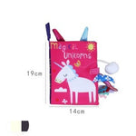 Children's book with unicorn design and colorful pens on a white background