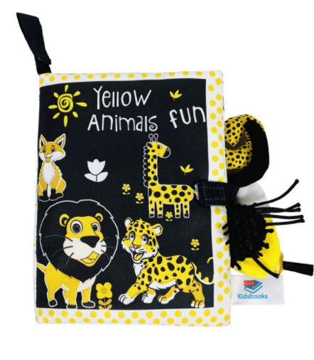 Children's book with yellow animal illustrations on a black background