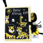 Children's book with yellow animal illustrations on a black background