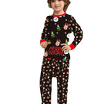 Child wearing a black Christmas-themed pajama set with red accents on a white background