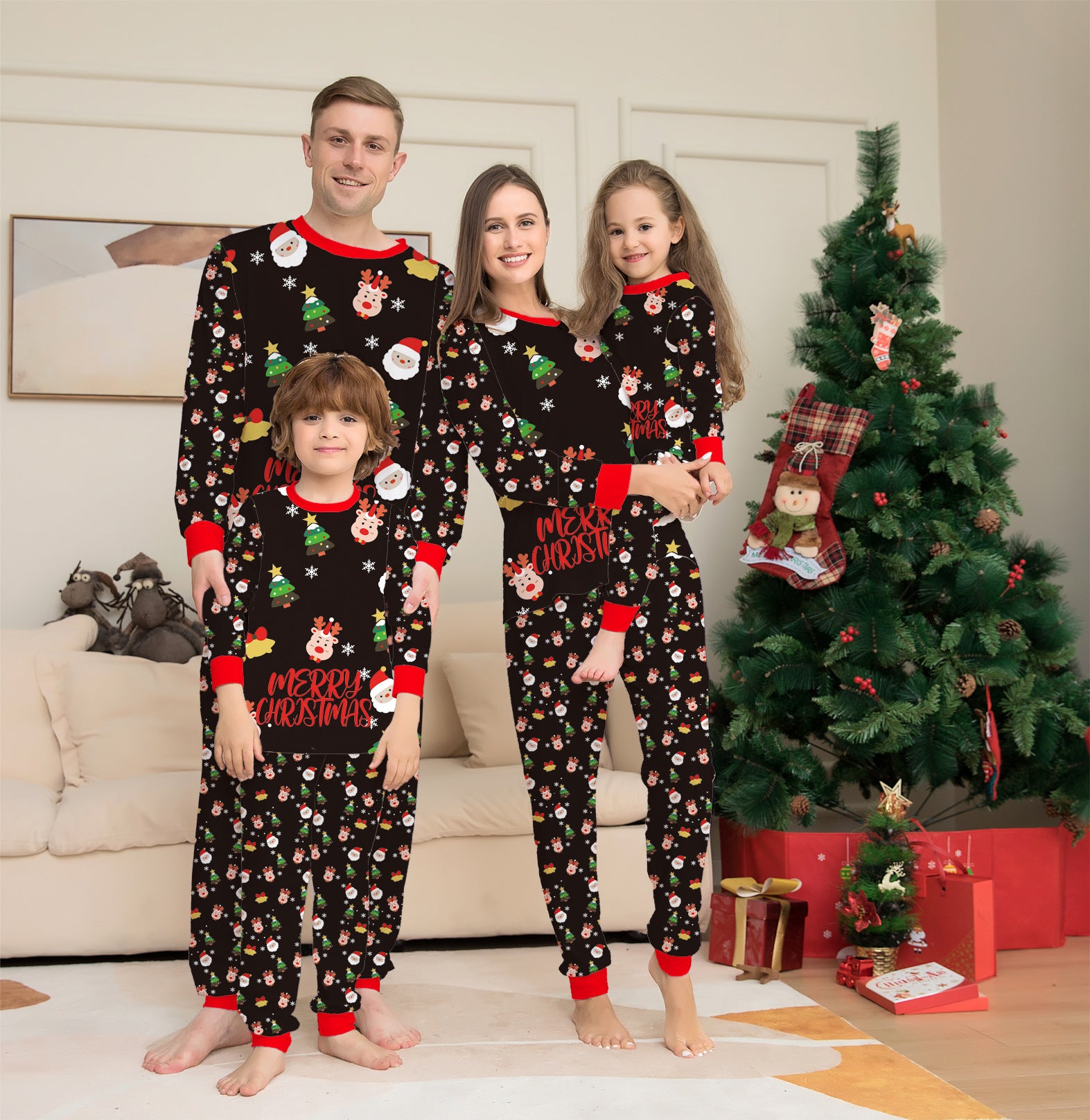 Family of four wearing matching Christmas pajamas in a living room with a decorated tree.