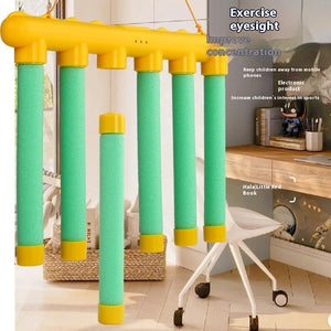 Yellow and green exercise equipment in a room with furniture and decor.