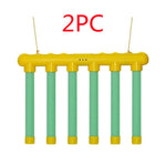 Yellow and green plastic structure with '2PC' text on a white background