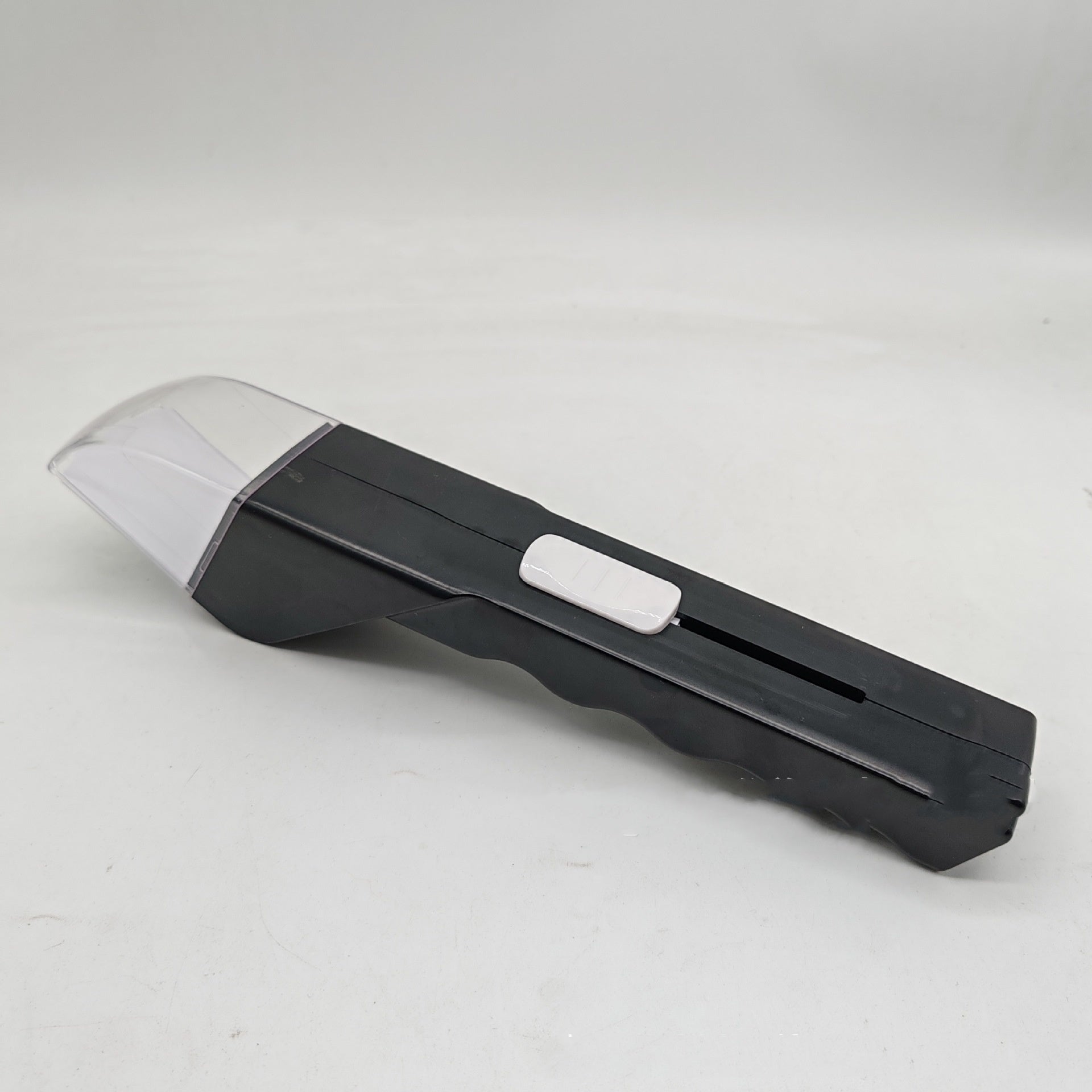Black and white tool on a light gray background