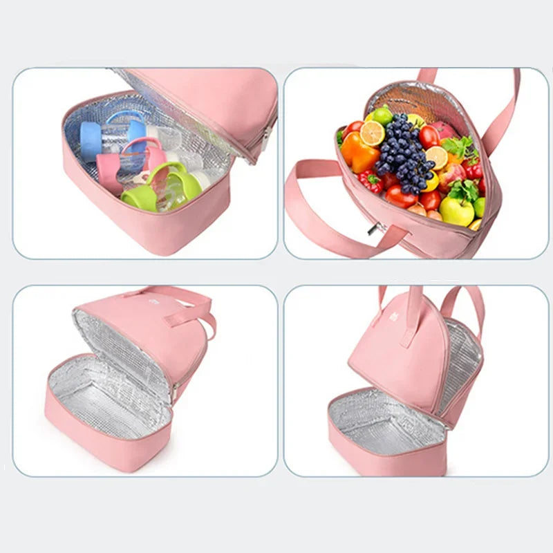 Pink insulated lunch bag with compartments for food and baby items on a light gray background