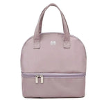 Pink handbag with a visible brand logo on a white background