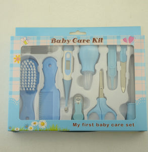 Baby care kit with various tools in a box labeled 'My first baby care set' on a light background.