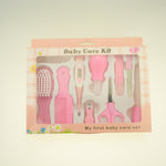 Pink baby care kit with various tools in a box on a light background