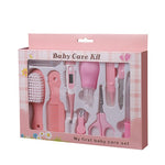 Baby care kit packaging with various tools on a white background