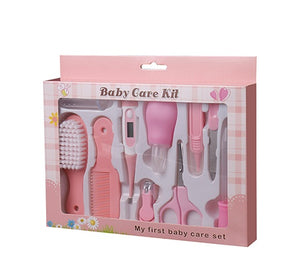Baby care kit packaging with various tools on a white background