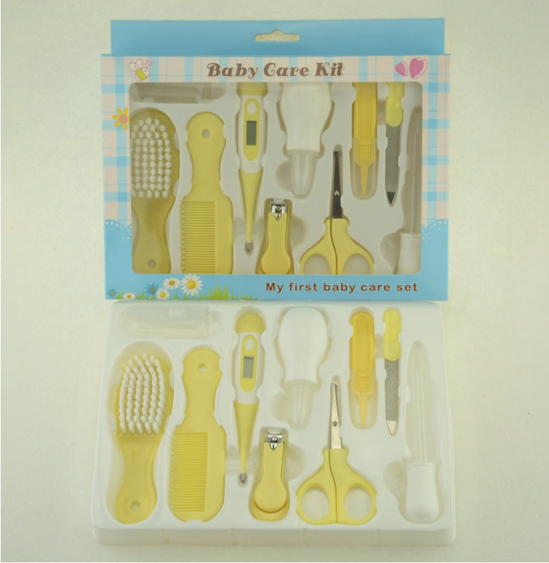 Baby care kit with various tools in a clear plastic bag on a light background