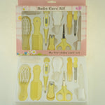 Yellow baby care kit with various tools in packaging on a light background