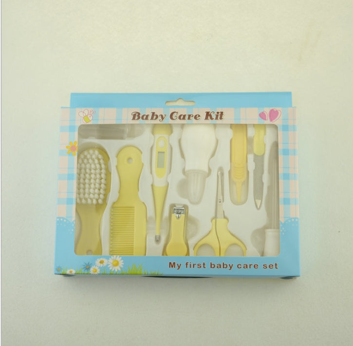 Baby care kit packaging with yellow tools on a light gray background