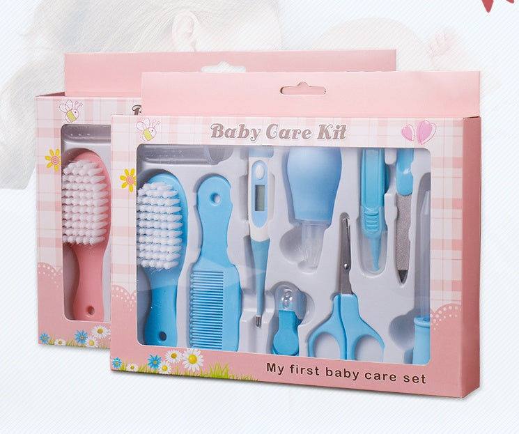 Baby care kit with various tools in a pink box on a white background