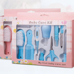 Baby care kit with various tools in a pink box on a white background