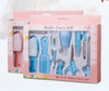 Baby care kit with various tools in a pink box on a white background