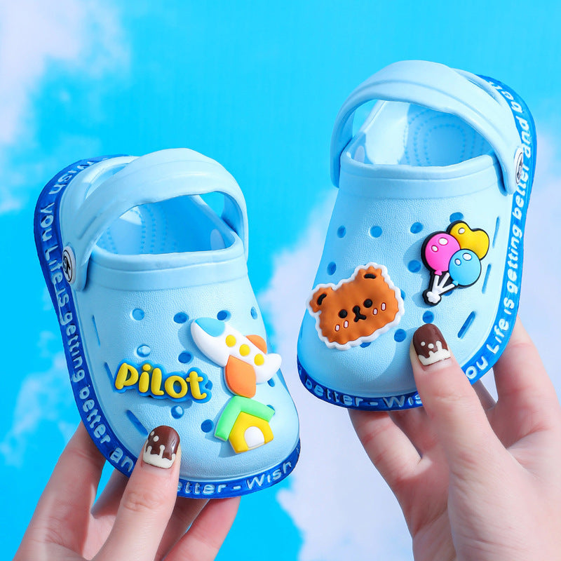Blue children's sandals with cartoon characters and 'Pilot' branding on a blue background