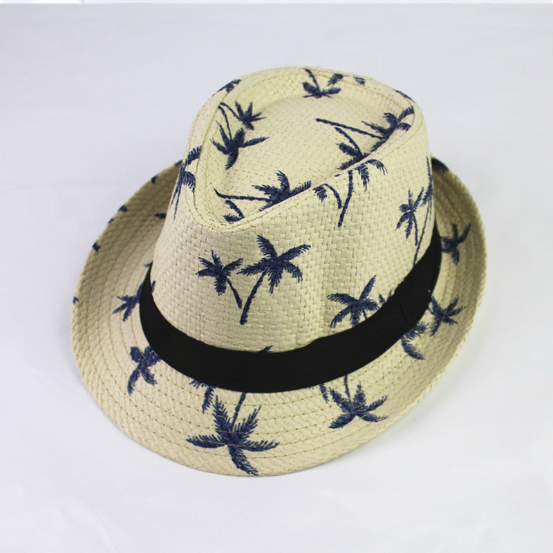 Beige straw hat with palm tree pattern and black band on a white background