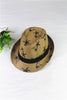 Woven hat with black palm tree pattern and band on a white background