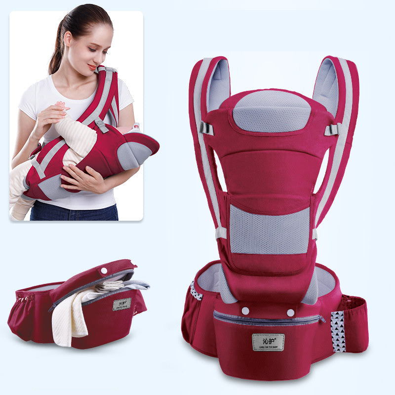 Red baby carrier with a woman holding a baby in it, on a light blue background.