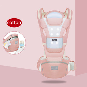 Pink baby carrier with 'cotton' label on a pink background