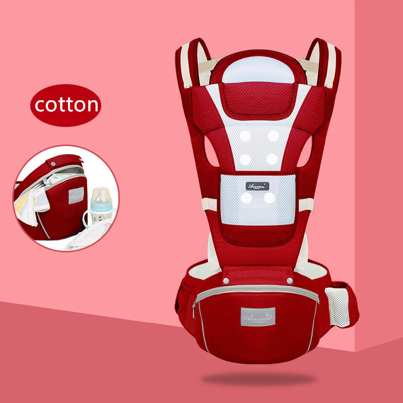 Red baby carrier with white accents on a pink background, featuring the brand 'Cotton'.