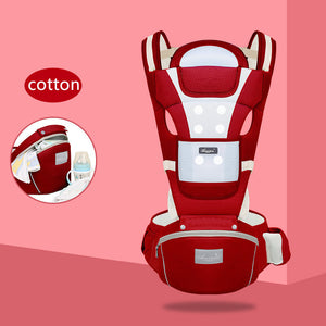 Red baby carrier with white accents on a pink background, featuring the brand 'Cotton'.