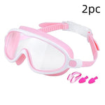 Pink and white swim goggles with earplugs on a white background
