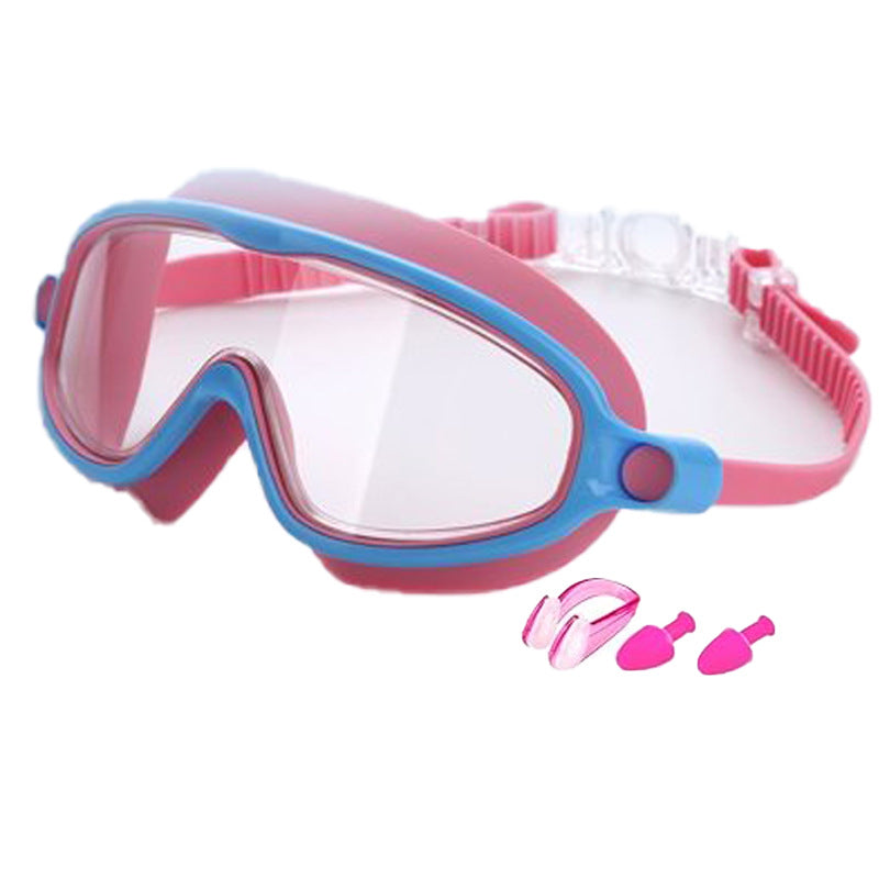 Pink and blue swim goggles with additional accessories on a white background