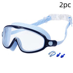 Diving mask with blue nose clip and earplugs on a white background