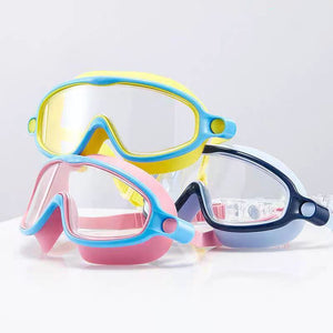 Three colorful swim goggles on a light gray background