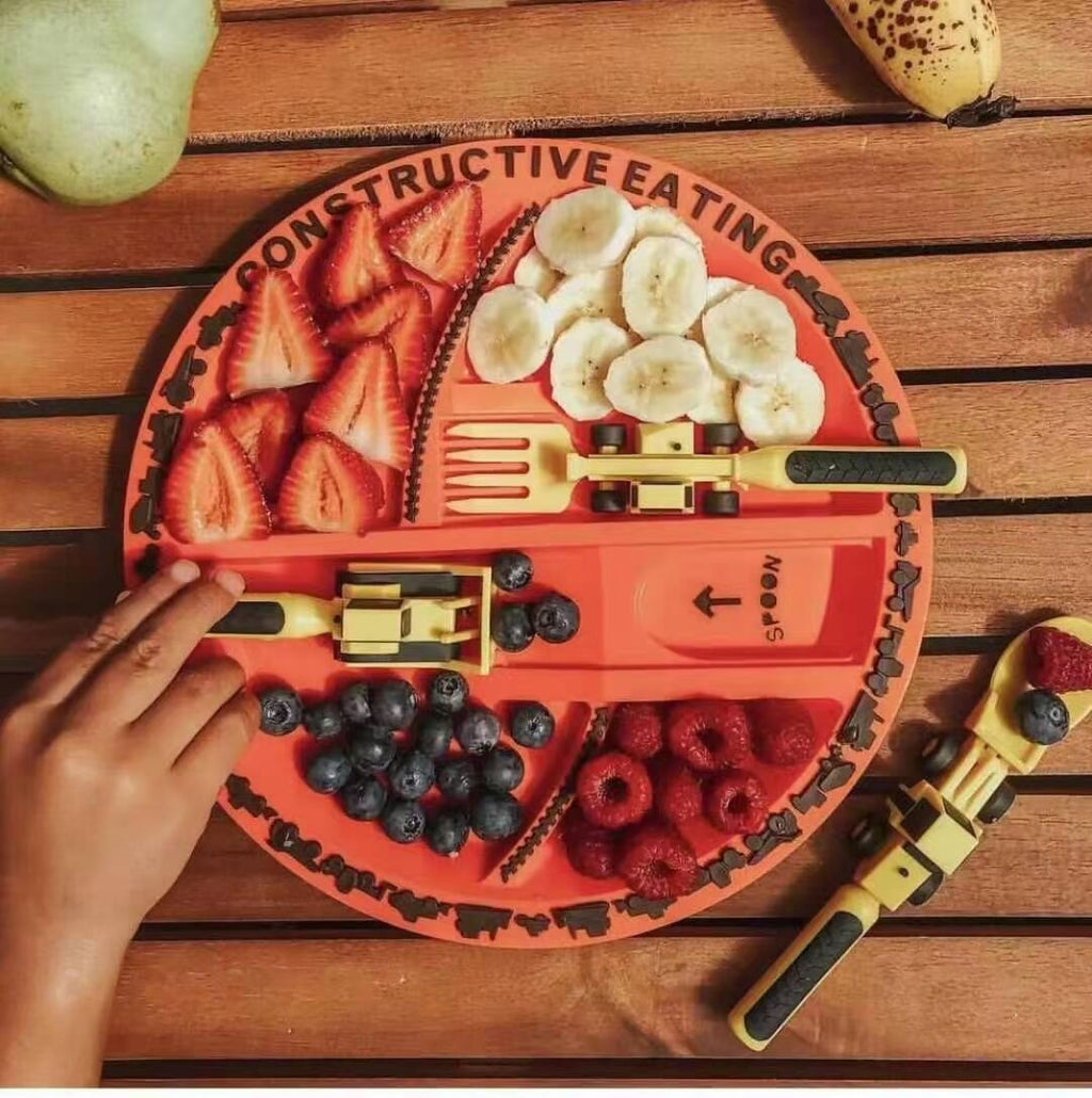 Fruit platter shaped like a skull with 'Constructive Eating' text on a wooden surface.
