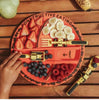 Fruit platter shaped like a skull with 'Constructive Eating' text on a wooden surface.